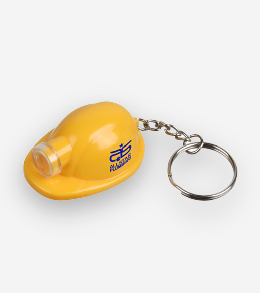 yellow miniature hard hat keychain featuring an integrated small flashlight on the front