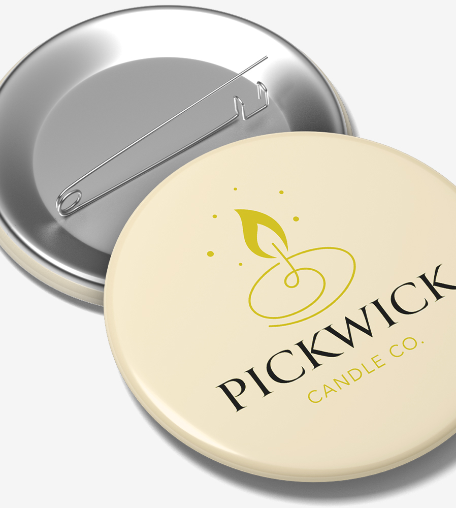 Tan lapel pin back button with another facing backwards behind it